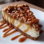 Caramel Apple Crisp Cheesecake with golden crumble and caramel drizzle
