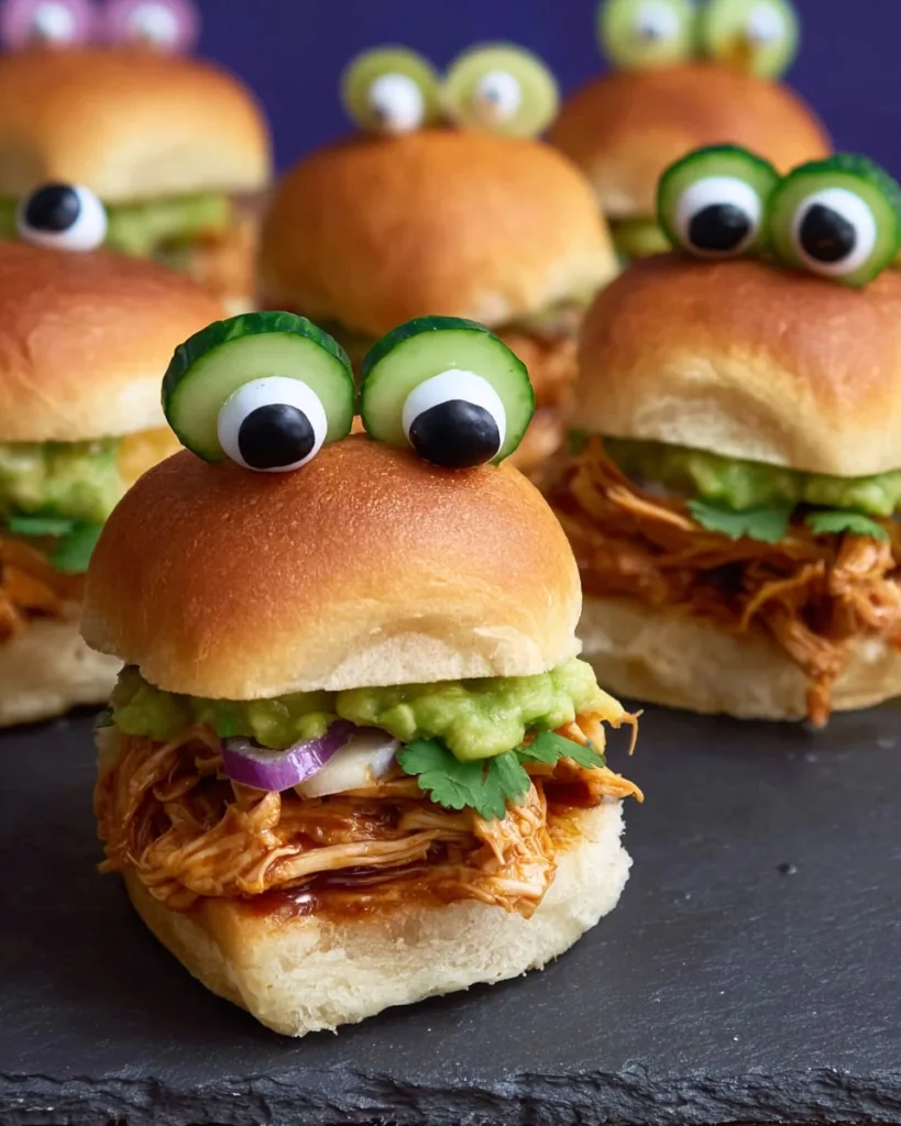 BBQ pulled chicken slider with guacamole and olive eyes for Halloween