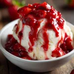 Homemade strawberry sauce on vanilla ice cream